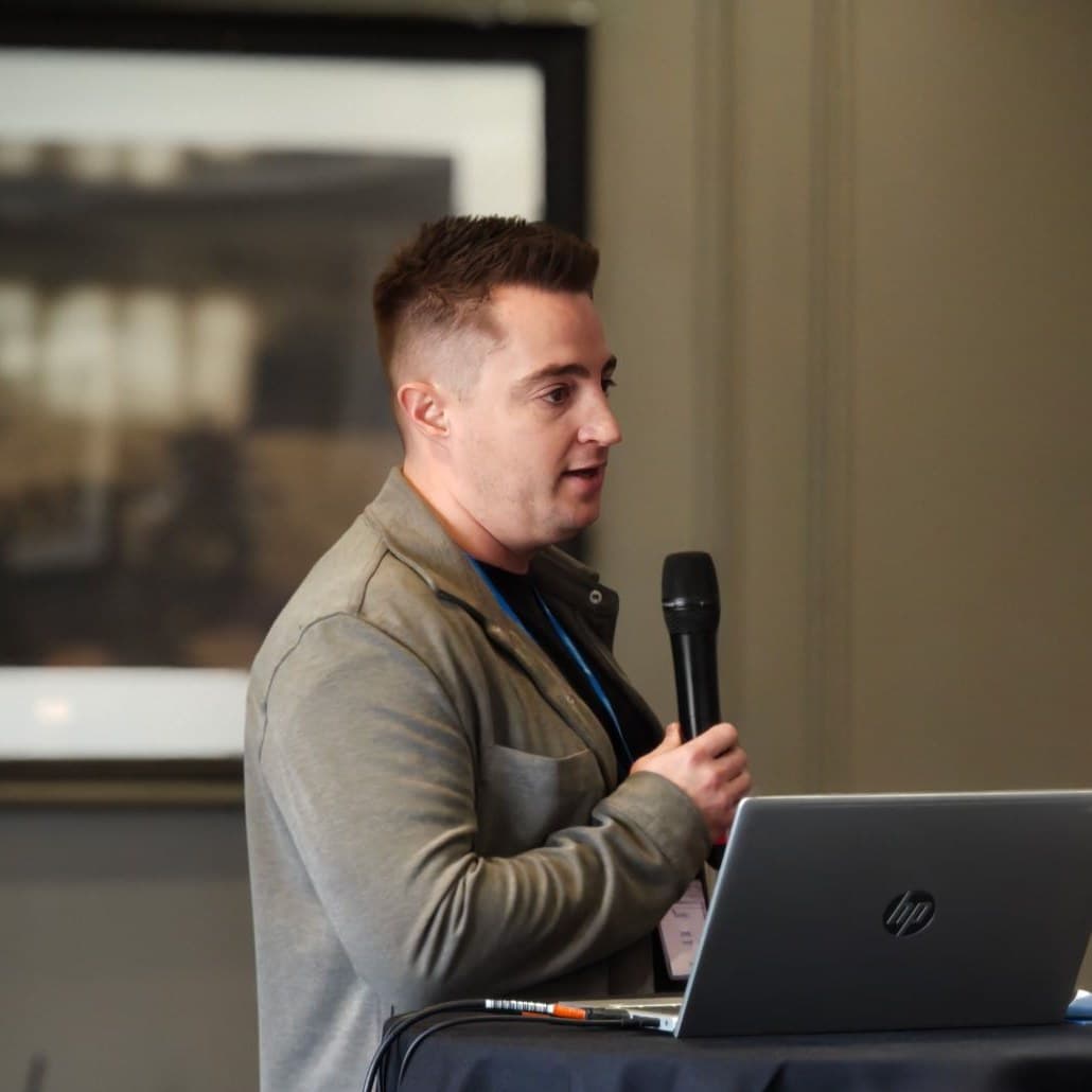 Jamie Marshall presenting on AI adoption at an industry event